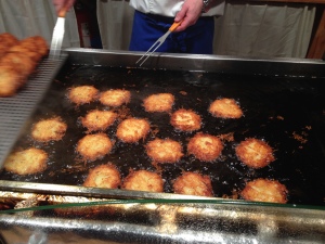 Cooking Riebekuchen - a sort of potato pancake eaten with applesauce- at a Christmas Market in Cologne