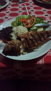 THIS is a whole fish, cooked just for us. You'll also notice the standard beans and rice, when mixed they are known as "Gallo Pinto"