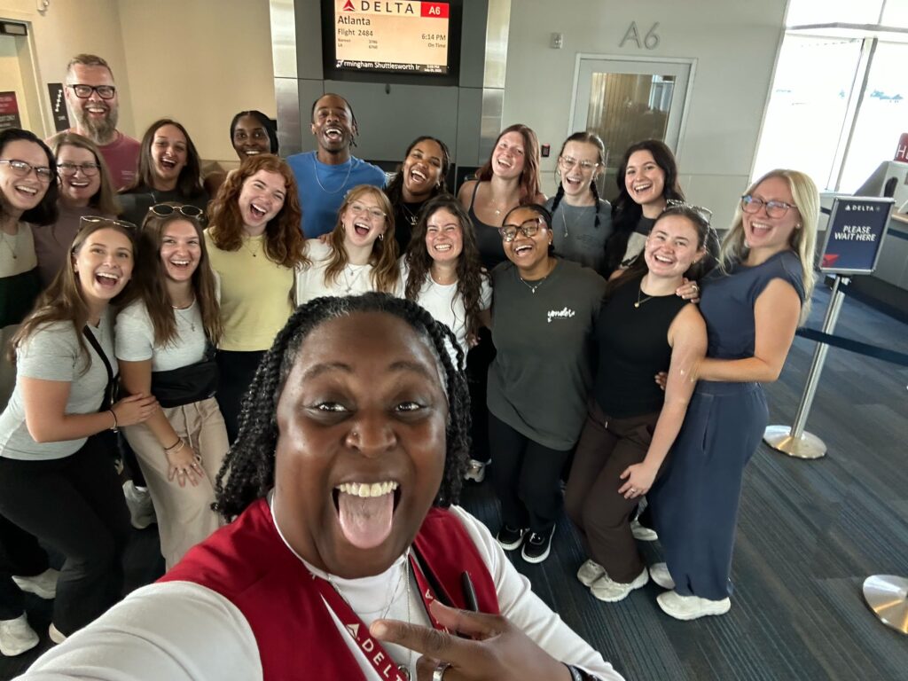 Yonder Contemporary Dance Company, before boarding the plane with a staff member!